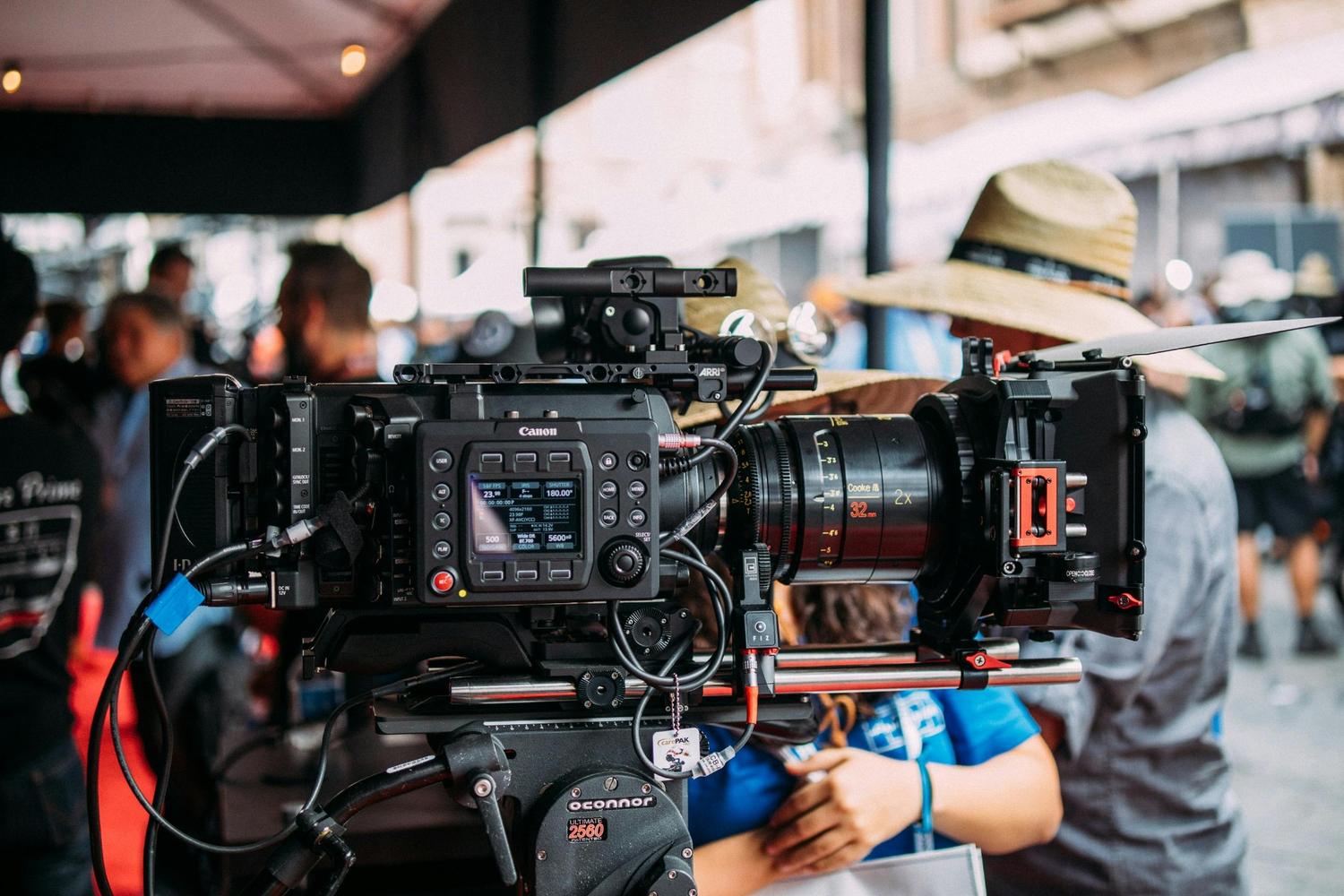 Dental video production in Houston showcasing a professional camera setup filming on an outdoor set.