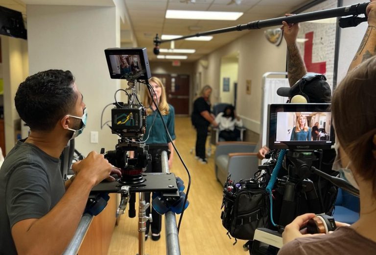 Commercial video production in Houston featuring a director filming a vibrant outdoor scene with professional equipment.