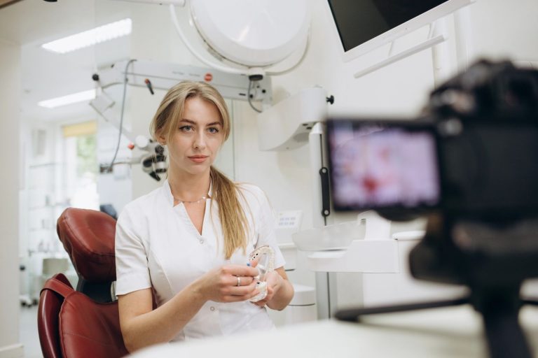 Dental practice marketing videos in Houston featuring a dentist showcasing dental tools on camera in a clinic.