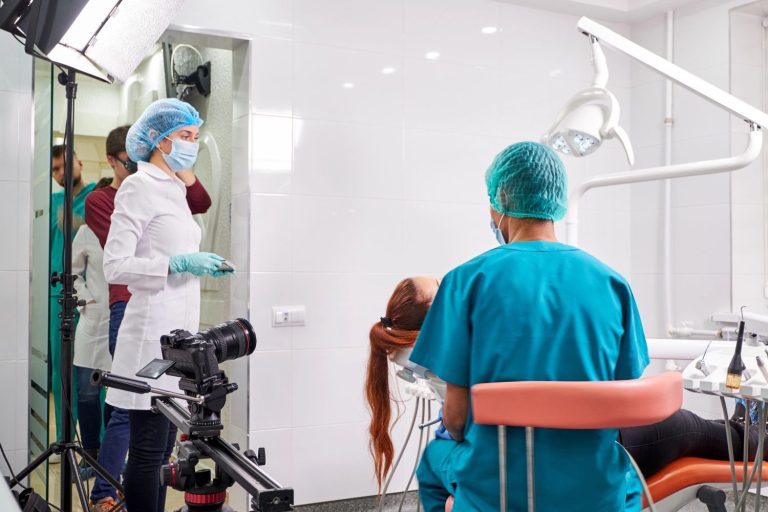 Dental practice marketing videos in Houston showcasing a dentist filming a procedure with a professional crew.