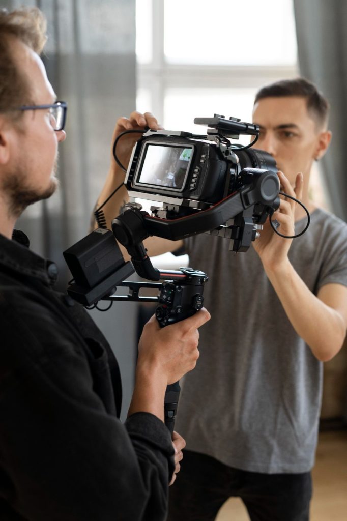 Behind-the-scenes of dentist explainer video production in Houston, with crew adjusting camera equipment on set.
