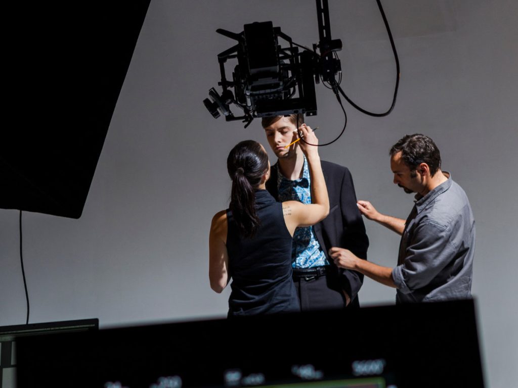 Team filming Dental Procedure Explainer Videos in Houston, adjusting camera and lights for professional, educational footage.