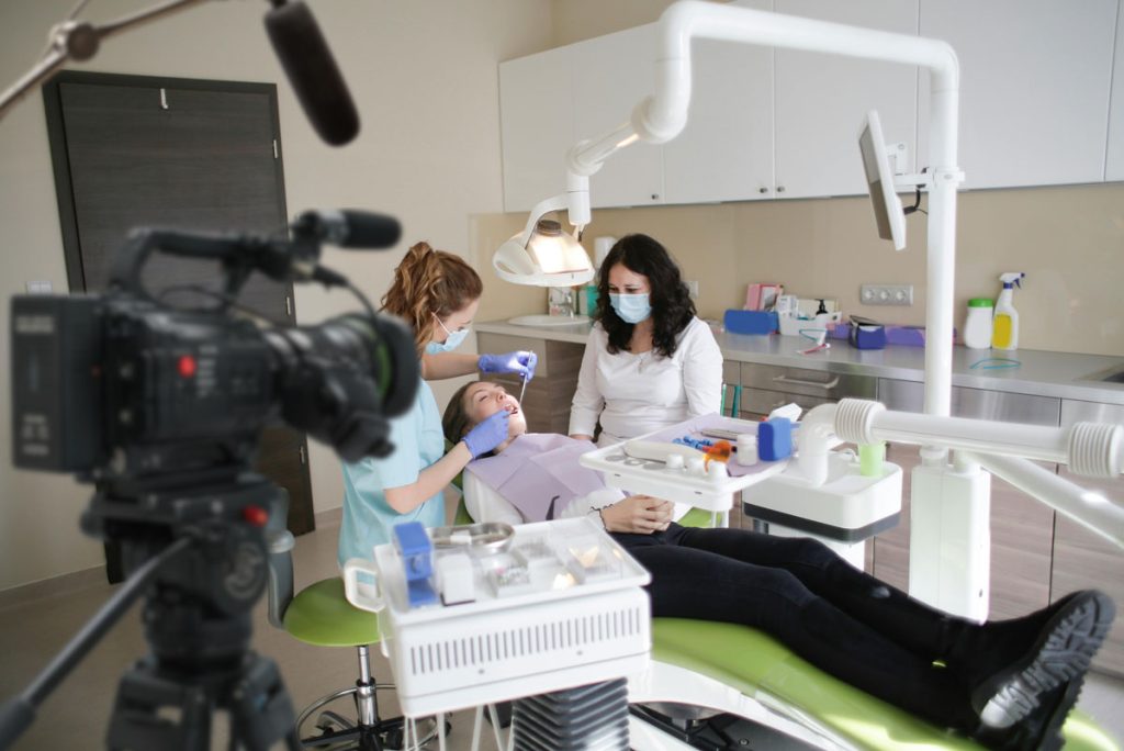 Dental team filming a live procedure for patient education with expert Dentist Explainer Video Production Houston services.