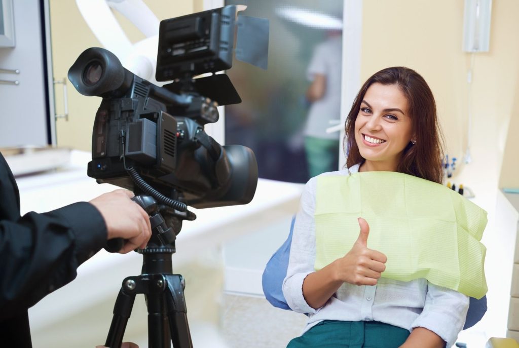 Smiling patient giving a testimonial for your top-tier Dental Practice Marketing Videos Houston campaign.