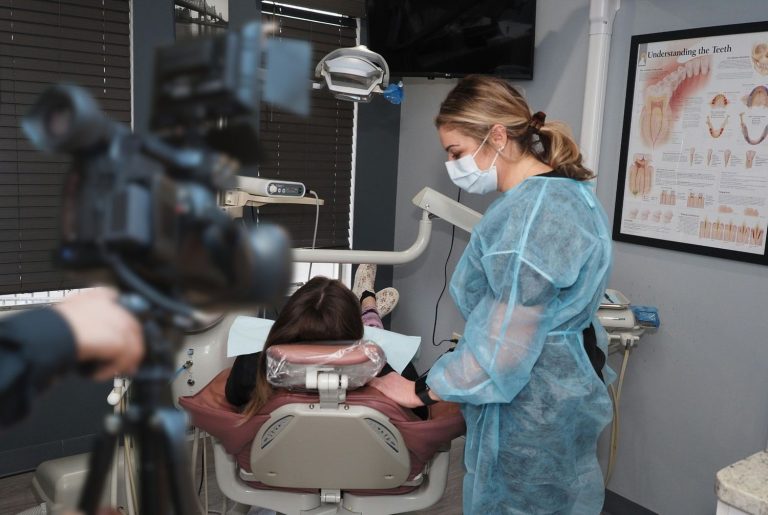Dentist explainer video production Houston filming patient interaction in a professional dental clinic.