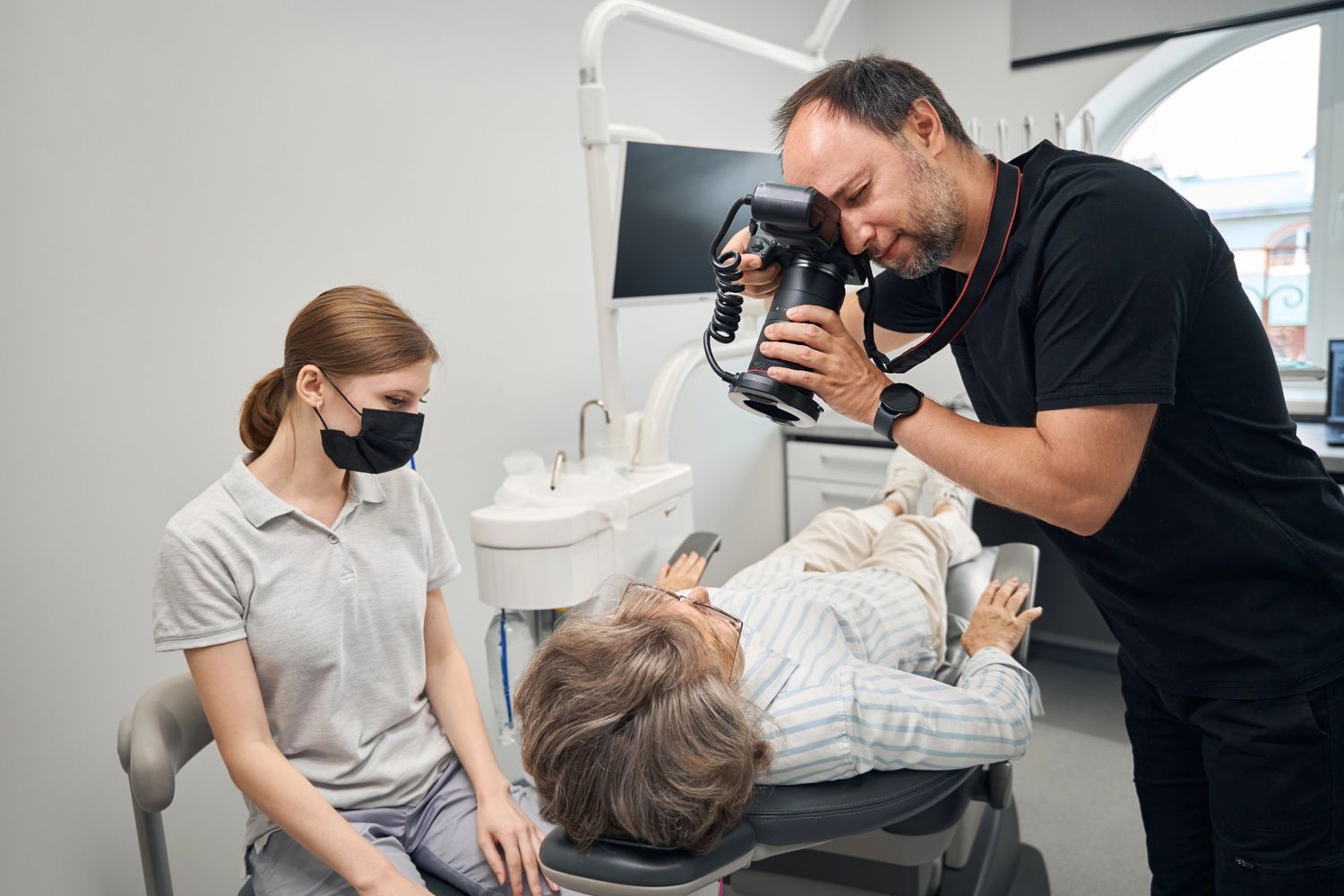 Dental team documenting real patient experience for procedure explainer videos in Houston.