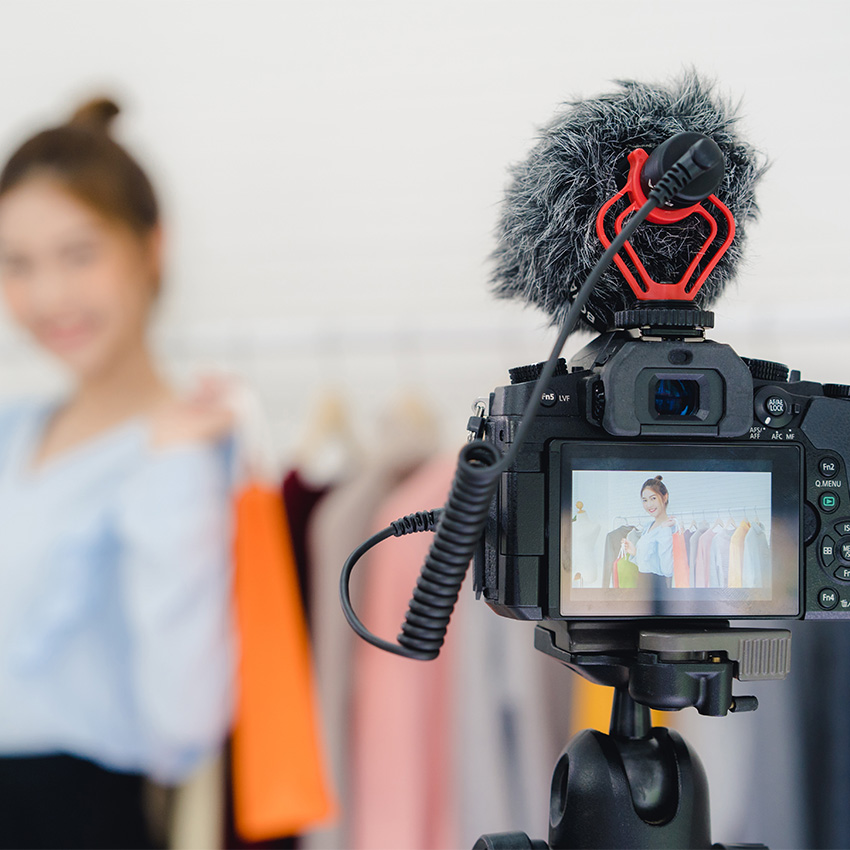 A creator filming a product demo with the best infomercial video production company Houston for social media marketing.