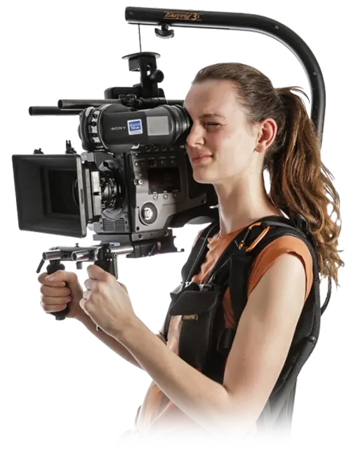 A professional camera operator using a cinema rig, representing expert video production services in Houston.