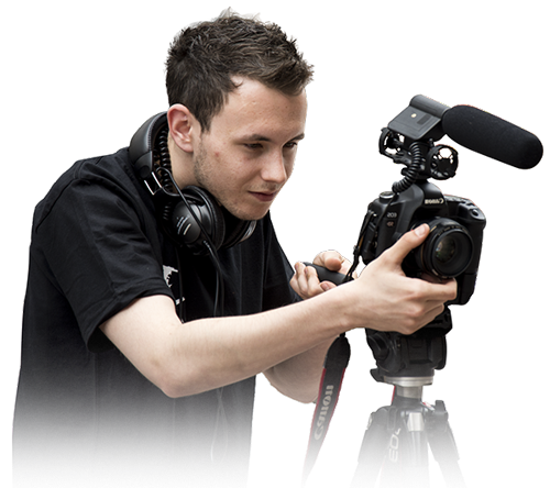 A professional from a videography company in Houston operating a DSLR camera with a shotgun microphone on a tripod setup.